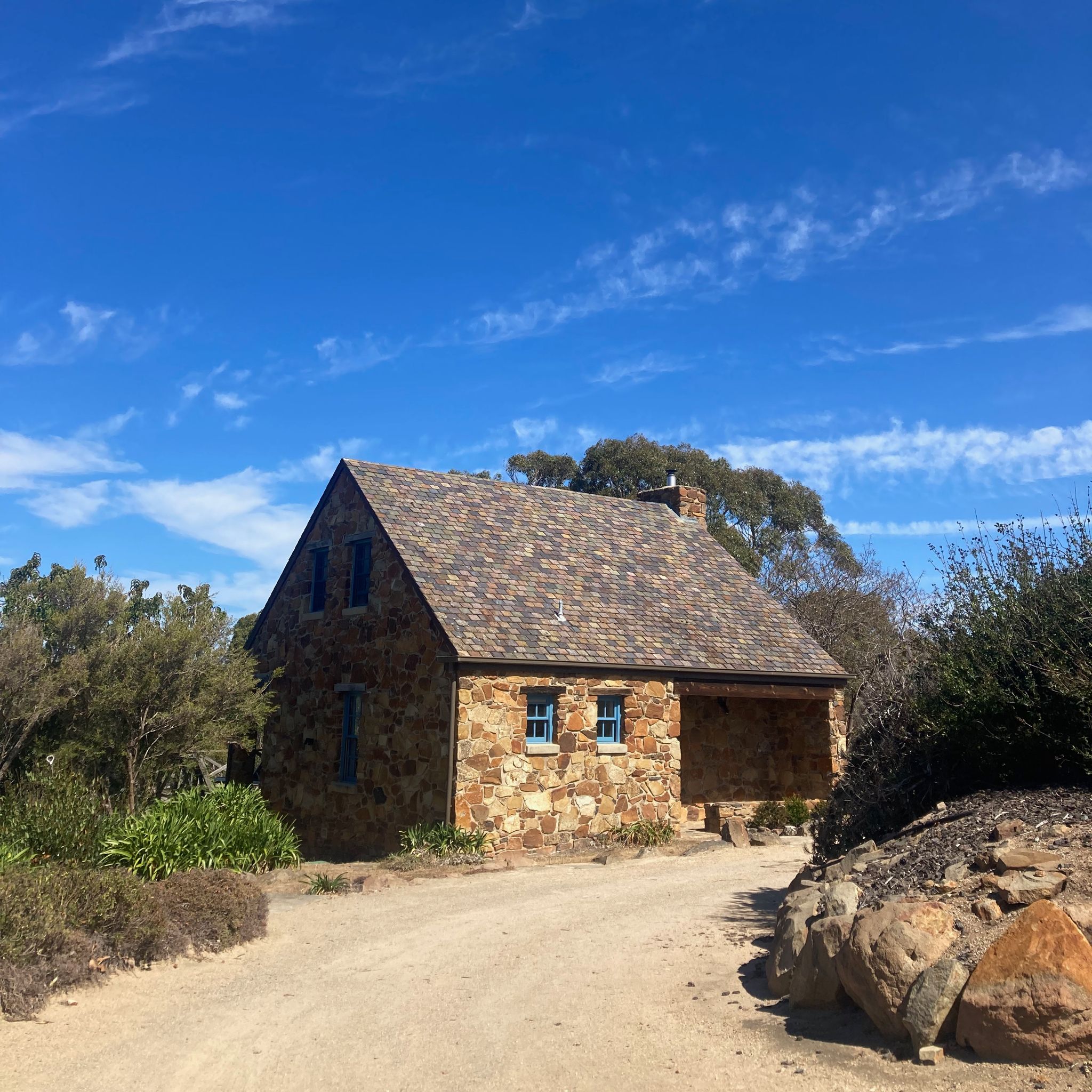 A small stone cottage in the coastal town of Swansea, in Tasmania.