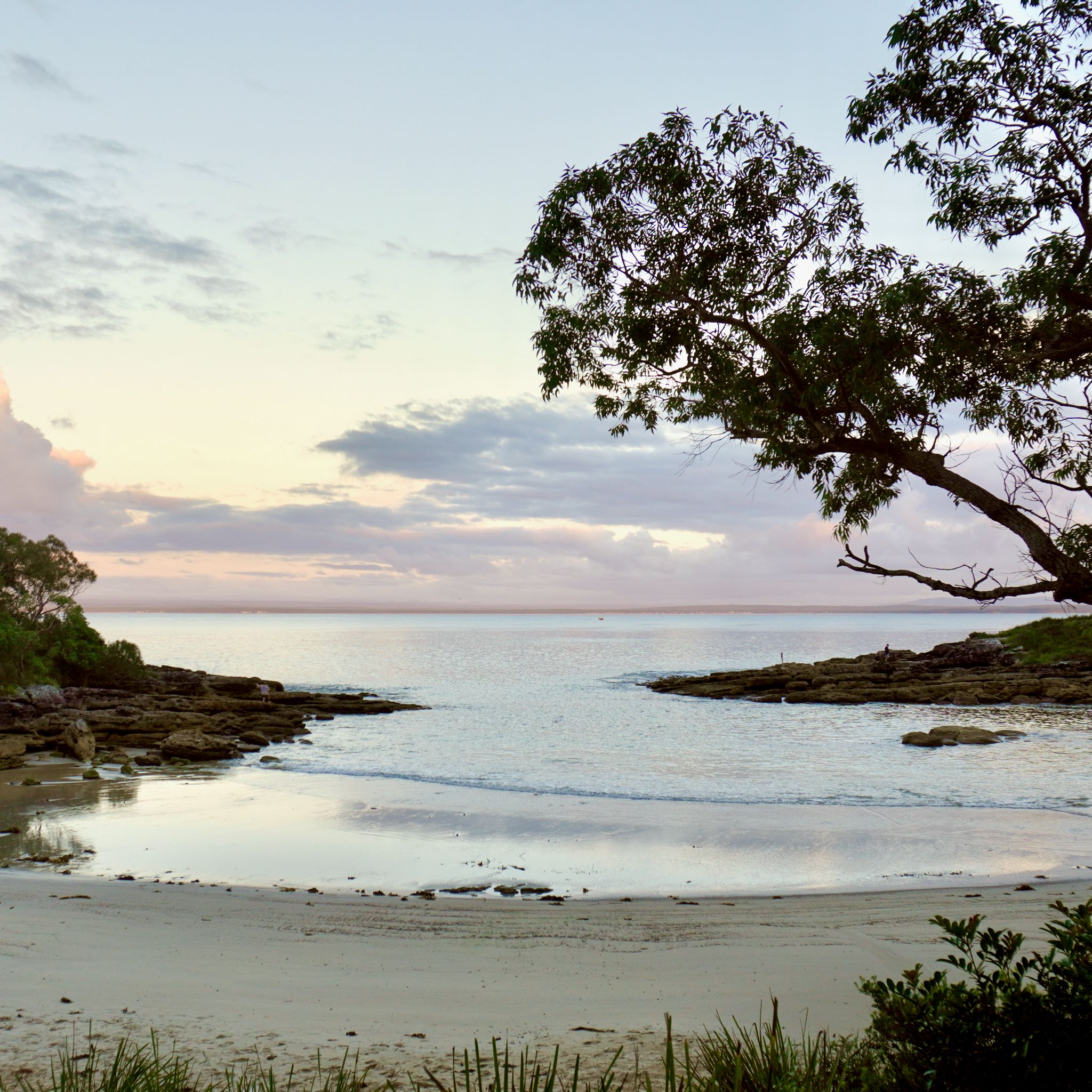 A sunset at Honeymoon Bay, the croissant-shaped beach in Australian Capital Territory.