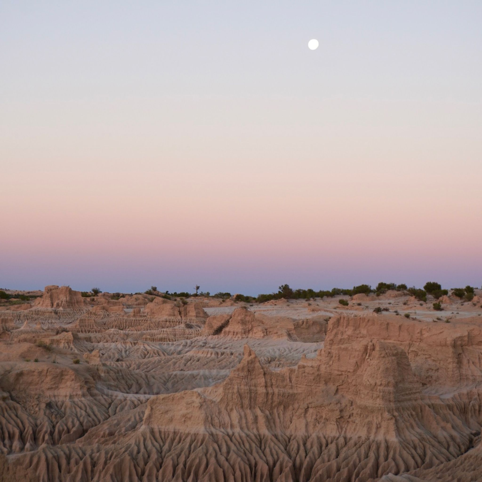 The cliffs of the Walls of China in Lake Mungo during sunset.